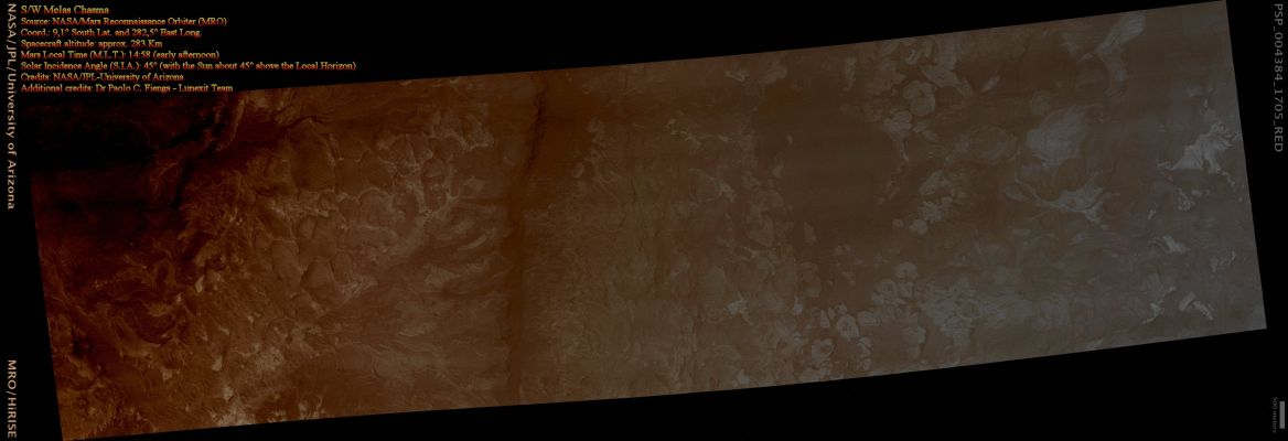 N/W Melas Chasma (Absolute Natural Colors; credits for the additional process. and color.: Dr Paolo C. Fienga - Lunexit Team)
This HiRISE image covers a portion of the Wallrock and Canyon Floor in South-Western Melas Chasma. 

Along the Floor of Melas Chasma is an unusual Blocky Deposit composed of light-toned Blocks in a darker matrix. The HR provided by the HiRISE camera reveals Layers only a few meters thick in some of the light-toned Blocks. The Blocks vary in size but most fall between approx. 100 up to 500 mts in diameter. Although most Blocks appear rounded, others have angular edges and can be very elongate. The morphologies of the Blocks suggest ductile deformation, such as from a flow or by tectonic disruption after emplacement. Aeolian Ripples are interspersed between the Blocks in the darker Matrix. 

Small valleys can be seen along the Wallrock. The Wallrock is a mixture of two geologic units that differ mainly in their reflectance. The light-toned unit appears to be thinner and only exposed in localized spots. Several of the light-toned Deposits are seen only in the Valleys, suggesting they were either deposited or are exposed by erosion.
Parole chiave: Mars from orbit - Melas Chasma Region