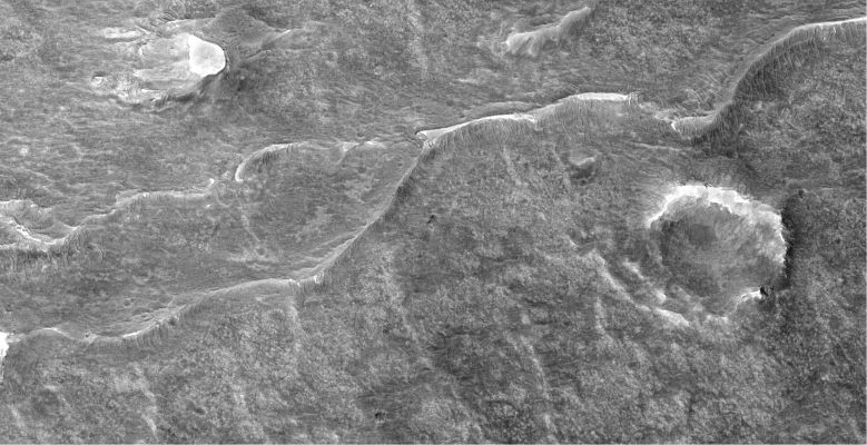 Low-Order Inverted Streams near Juventae Chasma  (extra-detail mgnf)
This subimage (approx. 1120 meters across) shows a juncture of 2 of the "Inverted Channels". 
It is likely that the water flowed from the left to the right of the scene, because channels usually join rather than divert unless there is an obvious obstacle in the way. 
No such obstacle is seen here, but one might have been present when the stream originally flowed. 
However, there is no way of knowing this.
Parole chiave: Mars from orbit - Juventae Chasma