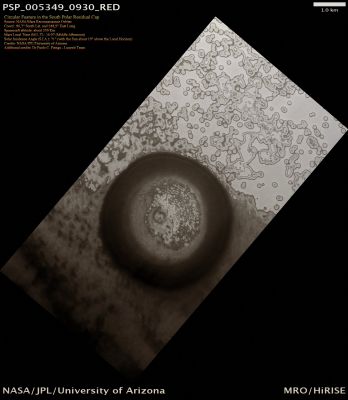 Circular Feature in the South Polar Residual Cap (Natural Colors; credits for the additional process. and color.: Dr Paolo C. Fienga - Lunexit Team)
This 4 Km-diameter Circular Surface Feature near the Edge of the South Polar Residual Cap was recognized in Mariner 9 and Viking Orbiter images taken in the '70s, but its origin could not be inferred. It was therefore targeted for HiRISE stereo imaging. 
The bright areas in this image are covered by CO2 frost, and the "Swiss Cheese" terrain typical of the South Polar Residual Cap covers much of the imaged area. 
The Dark Walls of the Circular Depression do not have as much Frost on them, and are fractured in a polygonal pattern. Apparently the Surface of the Walls has been extensively modified by thermal expansion and contraction of water ice. It also appears that the "Swiss Cheese" Terrain of the Residual Cap has buried the Floor of the Circular Depression, as well as the Terrain surrounding the Feature, making it difficult to infer its origin. 
Its circular symmetry is consistent with an impact origin, but there is no evidence of a Crater Rim or Ejecta Blanket (perhaps because they have been buried). 
The Depression may also have formed by collapse, but there is little evidence of extensional fractures that would be expected around a Collapse Pit. Analysis of HiRISE stereo data may help the interpretation of this Feature.
Parole chiave: Mars from orbit - South Polar Features - Possible Buried Impact Crater