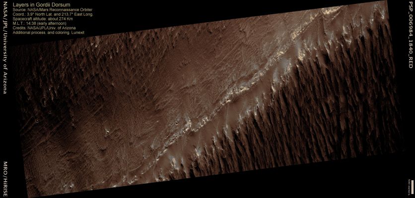 Layers in Gordii Dorsum (MULTISPECTRUM; credits: Lunexit)
This image shows distinctive differences in the texture of the ground surface in an area of Mars called Gordii Dorsum.

The upper right part of the image contains many subparallel ridges. These ridges are geological features called yardangs (long irregular ridges carved by wind erosion). The lower half of the image is smoother and contains a few small knobs and ridges. This area of Mars contains extensive outcroppings of layered sedimentary rocks that may have formed by the accumulation of sand and dust either blown in by the wind, transported by water, or some combination of processes such as these.

The distinctive surface textures may be due to differences in the rock structure and formation process. Mapping differences in the surface textures such as these may help to reveal how these rocks formed and advance our understanding of the geologic history of Mars.
Parole chiave: Mars from orbit - Layers - Gordii Dorsum