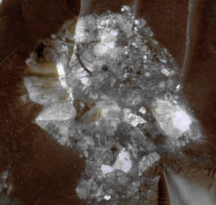 Megabreccia inside Toro Crater (EDM - Natural - but strongly enhanced - Colors; credits: NASA/JPL/Univ. of Arizona and Dr Paolo C. Fienga - Lunexit Team)
This EDM shows a close-up of one of the features that make Toro Crater a great target for HiRISE images: colorful patches of Megabreccia. 
Breccia is a mixture of chunks of rock (clasts) that have been broken by an energetic geologic event, such as a Landslide or Crater-forming Impact, and then that got cemented together in a finer grained material. 

Megabreccia features very large clasts that are big enough for HiRISE to see on the surface - some even larger than 30 feet across. 
In this 200 meter (about 1/8 of a mile) diameter exposure of Megabreccia, clasts of various colors (indicating different kinds of rocks) and sizes have been exposed in the Uplifted Central Peak of Toro Crater.
Parole chiave: Mars from orbit - Craters - Toro Crater