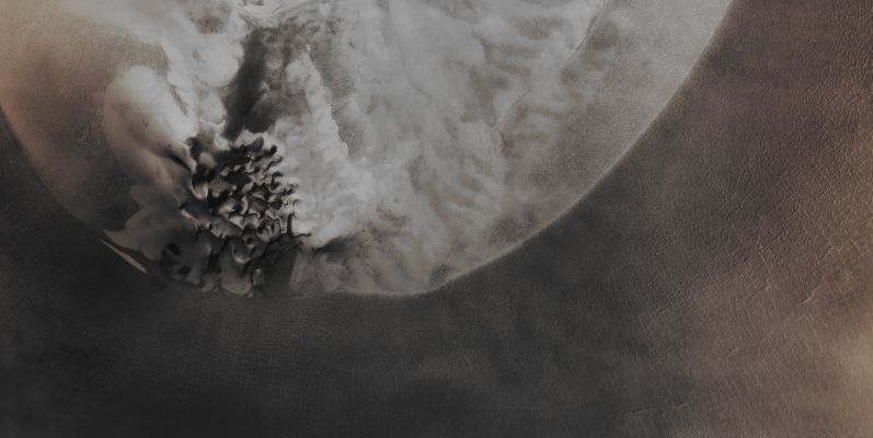 Frost all over Louth Crater (Absolute Natural Colors; credits for the additional process. and color.: Dr Paolo C. Fienga - Lunexit Team)
This image shows the changing Seasonal Frost Patterns on Louth Crater, located at about 70° North Latitude, in the Martian Region of Vastitas Borealis. This Crater contains a Mound (---> terrapieno) covered by Water Frost that persists throughout the year (which is an unusual circumstance for this Latitude); however, even the Seasonal Carbon Dioxide (CO2) Frost deposited during the Northern Winter can reach such a Latitude. At the time this image was acquired (such as during the Northern Spring), the Carbon Dioxide Frost was in the process of sublimating back into the Martian Atmosphere. Note that there are Sand Dunes near the edge of the Mound, which become clear of Frost in the Summer.

Mars Local Time: 14:32 (Early Afternoon)
Coord. (centered): 70,228° North Lat. and 103,538° East Long.
Spacecraft altitude: 316,2 Km (such as about 197,6 miles) 
Original image scale range: 31,6 cm/pixel (with 1 x 1 binning) so objects ~ 95 cm across are resolved
Map projected scale: 25 cm/pixel
Map projection: POLAR STEREOGRAPHIC
Emission Angle: 1,7° 
Sun - Mars - MRO (or "Phase") Angle: 54,7°
Solar Incidence Angle: 56° (meaning that the Sun is about 34° above the Local Horizon)
Solar Longitude: 50,3° (Northern Spring - Southern Autumn)
Credits: NASA/JPL/University of Arizona
Additional process. and coloring: Lunar Explorer Italia
Parole chiave: Mars from orbit - Craters - Louth Crater