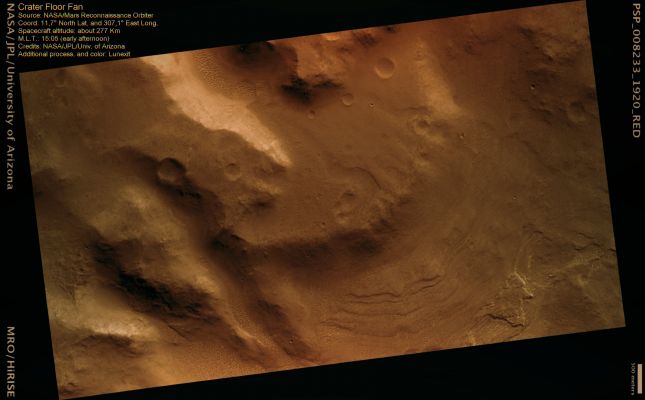 Crater Floor Fan (MULTISPECTRUM; credits: Lunexit)
This image shows a Fan of material deposited on the floor of a large Impact Crater.

The material was transported into the Crater through a valley, likely by running water. The end of the valley is visible in the West (lower) part of the image. Arcuate steps visible in the East are probably due to layers of different strength or cohesion; these suggest variations in the flow conditions.
A faint Trough is carved into the upper surface of the Fan. This could have been cut by the last water to flow across the surface. If the channel was flowing into a lake, this might indicate a drop in lake level, leading to erosion. 
The surface of the Fan has many small dark spots, particularly on the upper tier. 
The largest spots, most commonly around impact craters, are big enough to show that these are boulders. 

If these boulders are original and not due to the hardening of fan sediments into rock, it suggests that the flows which deposited the Fan were relatively energetic events able to carry rocks across several feet.
Parole chiave: Mars from orbit - Craters - Unnamed Crater with Fan