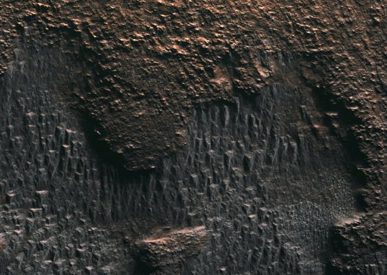 Autumn in Hellas Basin (edm n. 1 - MULTISPECTRUM-2; credits: Lunexit)
Frost is condensing, and shows up as silver/gray patches in this MULTISPECTRUM image: this is seasonal CO2 frost. 

Closer to the Pole, CO2 condenses from the atmosphere and forms a Seasonal Polar Cap. At this latitude we do not expect a thick layer to form but rather the frost collects in cold protected areas on poleward-facing slopes.
Parole chiave: Mars from orbit - Hellas Basin