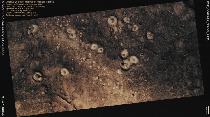 Mounds in Acidalia Planitia (Enhanced Absolute Natural Colors; credits for the additional process. and color.: Dr Paolo C. Fienga - Lunexit Team)
Caption NASA:"This image shows bright mounds scattered throughout a rather flat, dark landscape. These mounds range approximately between 20 and 500 meters (yards) in diameter.

The largest among them show central crater-like depressions which give them an appearance similar to terrestrial volcanoes. The origin of these mounds is still unclear. The most widely accepted hypotheses involve extrusion of underlying fluid-like materials (lava, wet/icy sediments) through weak points in the surface. 
Similar mounds have been observed elsewhere in the Northern Lowlands (the Northern Lowlands encompass a vast region of Mars younger than the rest of the Planet, as shown by lower number of impact craters, and well below its average altitude). Mounds such as the ones shown in this image may hold important clues for scientist to decipher the history of the Northern Lowlands: an old ocean basin? 
The site of continental-scale volcanism? 
Detailed analysis of HiRISE and other complementary datasets will help solve this mystery".
Parole chiave: Mars from orbit - Acidalia Planitia