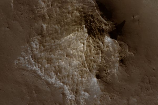 Long Shadows over Ariadnes Colles (edm - natural colors; credits: Lunexit)
This edm shows one of the hills in detail.

The hill appears criss-crossed by long fractures and most of them made apparent by the shadows they cast. 
The shadows indicate that the fractures “stick out” from their surroundings, and hence that they are more resistant to erosion. In terrestrial environments this occurs when fluids flow along the fractures, leaving behind cementing minerals or when fractures are filled by igneous materials.
Parole chiave: Mars from orbit - Ariadnes Colles Region