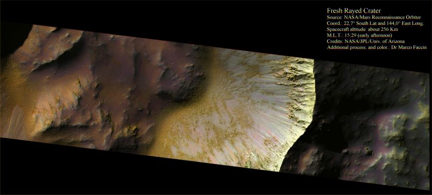 Fresh 5-Kilometer Diameter Rayed Crater (False Colors; credits: Dr M. Faccin)
The crater featured in this scene formed on top of ejecta from a nearby rampart crater, located to the North.
The crater’s distinct rim indicates that it is relatively young. There is bright material on many of the crater walls that might be landslides of dust or another bright substance. 
The mounds of material on the crater floor probably formed during late stages of crater’s own formation. The crater floor is speckled with even smaller craters.
Parole chiave: Mars from orbit - Craters - Fresh Unnamed Crater