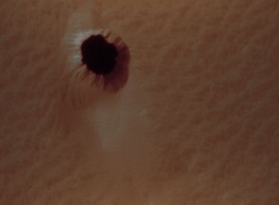 Martian Caves (edm n. 3 - possible natural colors; credits: Lunexit)
Cave environments can also protect organic life from extremely harsh conditions on the Martian Surface, and may provide future human explorers with secure habitats. Accordingly, caves are considered among the most promising locations to find preserved evidence of past or present microbial life.

Furthermore, the challenges associated with Mars cave exploration may inspire a full range of new technologies, such as advanced robotics and target-specific landing capabilities.
Parole chiave: Mars from orbit - Collapse Pit - Peri-equatorial Region