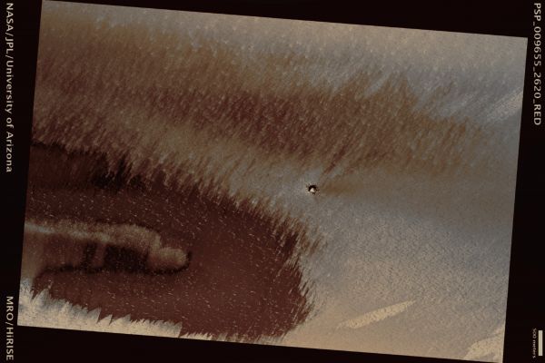 Small Crater on the North Polar Layered Deposits (possible True Colors; credits: Lunar Explorer Italia)
Mars Local Time: 14:02 (early afternoon)
Coord. (centered): 81,8° North Lat. and 333,1° East Long.
Spacecraft altitude: 318,6 Km (such as about 199,1 miles) 
Original image scale range: 31,9 cm/pixel (with 1 x 1 binning) so objects ~96 cm across are resolved 
Map projected scale: 25 cm/pixel 
Map projection: EQUIRECTANGULAR 
Emission Angle: 4,9° 
Phase Angle: 64,3°
Solar Incidence Angle: 60° (meaning that the Sun is about 30° above the Local Horizon)
Solar Longitude: 114,1° (Northern Summer)
Credits: NASA/JPL/University of Arizona
Additional process. and coloring: Lunar Explorer Italia
Parole chiave: Mars from orbit - Craters - Unnamed Crater in the NPLD