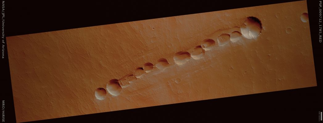 Pit-Chain in South-Western Pavonis Mons (possible True Colors; credits: Lunar Explorer Italia)
Mars Local Time: 15:30 (middle afternoon)
Coord. (centered): 1,4° South Lat. and 245,1° East Long.
Spacecraft altitude: 254,6 Km (such as about 159,1 miles) 
Original image scale range: 50,9 cm/pixel (with 1 x 1 binning) so objects ~1,53 mt across are resolved 
Map projected scale: 50 cm/pixel 
Map projection: EQUIRECTANGULAR 
Emission Angle: 0,5° 
Phase Angle: 56,9°
Solar Incidence Angle: 56° (meaning that the Sun is about 34° above the Local Horizon)
Solar Longitude: 116,2° (Northern Summer)
Credits: NASA/JPL/University of Arizona
Additional process. and coloring: Lunar Explorer Italia
Parole chiave: Mars from orbit - Volcanic Regions - South-West of pavonis Mons