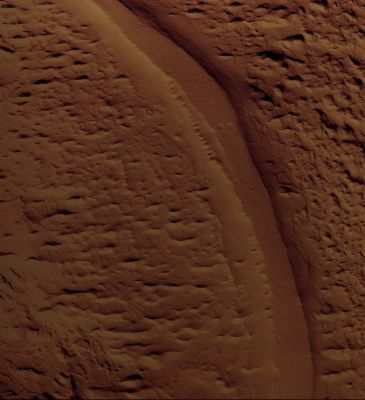 Inverted Channels and Yardangs in Aeolis Mensae (edm - natural colors; credits: Lunexit)
Aeolis Mensae is well-known for its unusual features commonly related to wind activity on the Planet’s Surface. Near the bottom of the image (see the edm here) is a long, sinuous, flat-topped feature that has been exposed by wind erosion. 
This sinuous ridge is one of several similar ridges in the region that are believed to be former stream channels now preserved in inverted relief.

On Earth, inverted relief occurs when formerly low-lying areas become elevated because the original depression is filled with materials, such as lava, that are more resistant to erosion than the surrounding terrain. In the case of stream channels, the streambed may contain larger rocks and/or sediments that have been cemented by chemicals precipitating from flowing water that remain, while adjacent fine material is blown away by the wind. In this location, it is most likely that water once flowed through this channel and deposited sediments that eventually filled the channel and became cemented. 
Over time, wind eroded the surrounding surface leaving the remnant channel exposed as a raised flat-topped ridge.

On either side of the Inverted Channel and throughout the image are several linear, streamlined ridges oriented roughly South to North. These are Yardangs, such as streamlined remnants of material shaped by the action of sand-blown sediments that eroded away weaker material. 
Landforms such as these are common in desert areas on Earth. The orientation of the Yardangs indicates the primary wind direction.
Parole chiave: Mars from orbit - Inverted Channels and Yardangs - Eolis Mensa Region