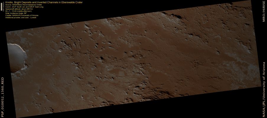 Features of Eberswalde Crater (natural colors; credits: Lunexit)
Eberswalde Crater is an approx. 65-Km diameter, closed Basin Crater. It contains a delta, which indicates that flowing water was present for an extended period of time in the past.
Parts of the Crater have inverted channels that have higher relief because a more resistant material was deposited in the channel and therefore it was less susceptible to erosion than the surrounding area. The image also shows resistant knobs and mounds as well as a scoured surface. 

The CRISM instrument on-board MRO has detected Phyllosilicates (Clays) in some of the bright layers here. On Earth, clays form in the presence of water, so this is more evidence that there was a persistent flow of water in Eberswalde.
Parole chiave: Mars from orbit - Craters - Eberswalde Crater