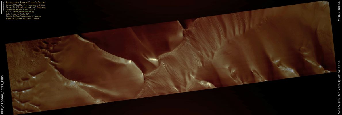 Spring over Russel Crater (natural colors; credits: Lunexit)
Spring is already starting to show its influence at the Russell Crater field of sand dunes. Channels down the face of the largest dune show dark spots where the sublimation of the seasonal carbon CO2 Ice Cap has begun.

This active process (where ice evaporates directly to gas) dislodges loose material, leaving dark streaks down steep slopes. The process starts when the Sun peeks above the horizon at the end of Antarctic Night. 
Bright streaks may be loose frost cascading down steep slopes.
Parole chiave: Mars from orbit - Craters - Russel Crater