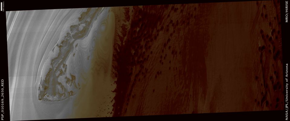 Dunes and other Surface Features in Chasma Boreale (ctx frame - possible True Colors; credits: Lunexit)
This image shows dark sand dunes in Chasma Boreale. Chasma Boreale is a giant trough that cuts into the North Polar Ice Cap for about 570 Km (approx. 350 miles) forming a broad valley bordered by stacked layers of ice. 
A portion of the North Polar Ice Cap is visible at the northern edge of the trough in the left portion of the image. 

Many dark toned sand dunes march down the trough under the winds’ direction. 

Coord.: 84,9° North Lat. and 331,8° East Long.
Spacecraft altitude: about 319 Km
M.L.T.: 13:35 (early afternoon)
Solar Incidence Angle: 67°
Parole chiave: Mars from orbit - North Polar Regions - Chasma Boreale