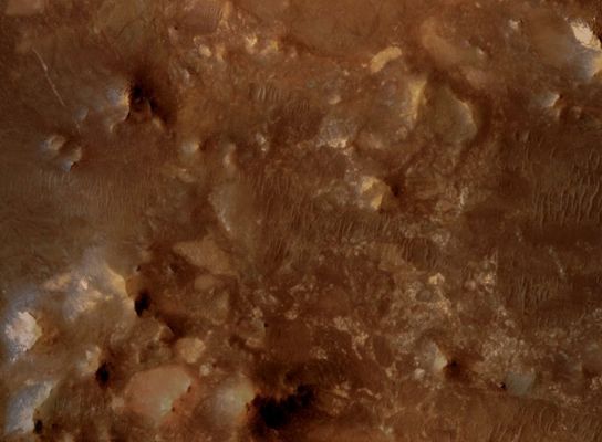 Ancient Bedrock and Megabreccia in Nili Fossae region (edm - possible True Colors; credits: Lunexit)
This edm shows a rock type known as Megabreccia, composed of numerous differently colored blocks, each up to 40 meters (130 feet) across, arranged in a seemingly disorganized array. 
Megabreccia forms when an energetic event, such as formation of an impact crater, breaks up pre-existing rocks and jumbles their fragments. Megabreccia is found in some of the most ancient rocks exposed on the Martian Surface.
Parole chiave: Mars from orbit - Megabreccia - Nili Fossae Region