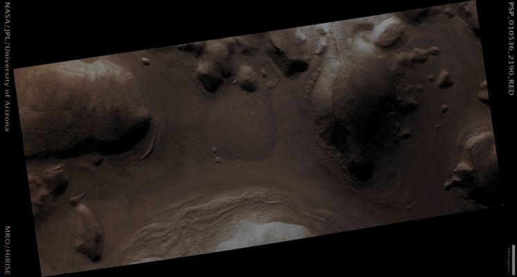 Flow-like Features in Nilosyrtis Region (Enhanced Absolute Natural Colors; credits for the additional process. and color.: Dr Paolo C. Fienga - Lunexit Team) 
Mars Local Time: 15:23 (Early Afternoon)
Coord. (centered): 38,5° North Lat. and 61,7° East Long.
Spacecraft altitude: 309,4 Km (such as about 193,4 miles) 
Original image scale range: 31 cm/pixel (with 1 x 1 binning) so objects ~ 93 cm across are resolved 
Map projected scale: 25 cm/pixel
Map projection: EQUIRECTANGULAR 
Emission Angle: 19,0° 
Phase Angle: 70,4°
Solar Incidence Angle: 51° (meaning that the Sun is about 39° above the Local Horizon)
Solar Longitude: 147,2° (Northern Summer)
Credits: NASA/JPL/University of Arizona
Additional process. and coloring: Dr Paolo C. Fienga - Lunar Explorer Italia 
Parole chiave: Mars from orbit - Flow Features