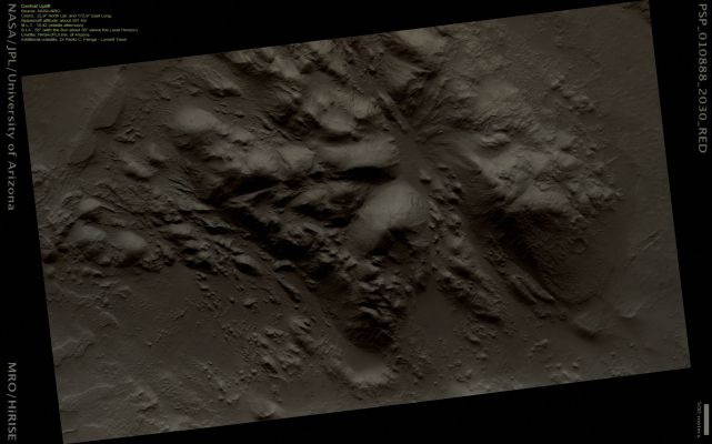 Mojave Crater's Floor and Central Uplift (Natural Colors; credits: Dr Paolo C. Fienga - Lunexit Team)
This observation shows a portion of the Central Uplift structure in Mojave Crater.
Central Uplifts are a typical feature of large Impact Craters on Earth, Moon and Mars; craters larger than 6 or 7 Km in diameter on Mars typically form this mountain-like peak in the central portion of the crater interior.
This Peak consists of rocks originating from several kilometers beneath the pre-impact surface. 

Mojave has a very prominent Central Uplift as it has a diameter of about 60 Km (apprx. 37 miles). In this image, boulders as large as about 15 meters (50 feet) across have been eroded from the massive uplifted rock and have rolled downslope. Fine-grained debris has also collected in the topographic lows, and has been shaped by the wind into Dunes and Ripples.

Notably absent from this image are the striking Drainage Channels and Alluvial Fans that are abundant on the wall-terraces and ejecta of Mojave Crater (see PSP_001415_1875). These features were likely formed by Surface Runoff of liquid water, which may have been released from the Subsurface during the impact event that formed Mojave.
Previously, it had been suggested that a brief, torrential downpour over Mojave Crater delivered the water. However, Mars Orbiter Camera's (MOC) images of Mojave's Central Uplift have previously shown no evidence for Surface Runoff, and the higher resolution of this HiRISE image confirms that this part of the Crater appears untouched by liquid water.

So the question remains: by what means was the water, in the form of Runoff, supplied to Mojave? This question, in addition to several others regarding this phenomenon, are currently being investigated by the HiRISE team and their collaborators.
Parole chiave: Mars from orbit - Craters - Mojave Crater - Central Uplift