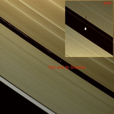 Pan and its Shadow (Natural Colors; credits: Lunar Explorer Italia)
Caption NASA:"Wendy Darling famously helped Peter Pan catch his shadow, and now Cassini captures the shadow of another Pan: Saturn's 30-kilometer (19-mile) wide moon inhabiting the Encke Gap. 
In the center of this image, the shadow of Pan is a short streak thrown over the edge of the A-Ring where Pan travels its path through the Encke Gap. A second version of this image has been included to focus on Pan's shadow. The image has been scaled to three times its original size and cropped as shown in the inset. 

One of the happy results of Saturn's 29-year revolution around the Sun is the changing elevation of the Sun seen from the Planet, and the changing elevation of the shadows of the Rings and moons that the Sun's apparent motion brings. 
As Saturn approaches Equinox, the angle at which the ringplane is inclined away from the Sun will continue to decrease until August 2009, when Equinox will bring about an alignment of the plane containing the rings with the rays of the Sun. Only around the time of Equinox is a moon's shadow cast on the Rings rather than the Planet. Between now and Equinox in August, the shadows cast by the moons on the Rings will grow longer with time".
Parole chiave: Saturn's Moon - Pan