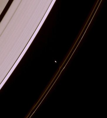 Orb-at-Work! (natural colors; credits: Lunexit)
Caption NASA:"Prometheus draws material from the F-Ring along an invisible thread of gravity. Near lower left is an identical feature the moon created on a previous pass near the Ring. 
Prometheus (approx. 102 Km, or about 63 miles across) is overexposed in this image, which was taken as part of a sequence designed to help refine scientists' understanding of the orbits of Saturn's small moons. This view looks toward the unlit side of the Rings from about 41° above the Ring-Plane. 

The image was taken in visible light with the Cassini spacecraft narrow-angle camera on March 14, 2007 at a distance of approx. 1,8 MKM (such as about 1,1 MMs) from Prometheus. 
Image scale is roughly 11 Km (about 7 miles) per pixel". 
Parole chiave: Saturn's Moon - Prometheus