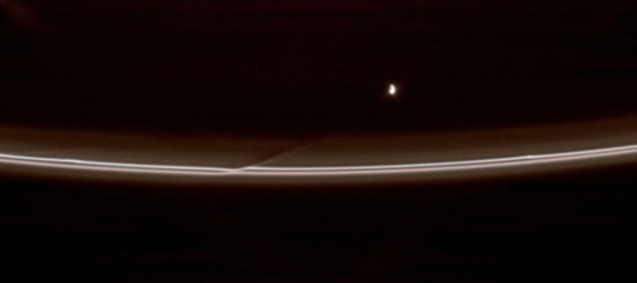 Cosmic "Through-and-Through"!
Caption NASA:"Prometheus pulls away from an encounter with Saturn's F-Ring, leaving behind a reminder of its passage. 
Prometheus (about 102 Km, or 63 miles across) approaches closely to the F-Ring once during each circuit around Saturn, disturbing the orbits of the small particles in the Ring and creating a streamer of material that then shears out, following the moon as it speeds off. 
This view looks toward the unilluminated side of the Rings from about 37° above the Ring-Plane. Prometheus is brightly lit by the Sun on one side and lit more modestly by Saturn's reflected light on the other side. 

The image was taken in visible light with the Cassini spacecraft narrow-angle camera on April 18, 2007 at a distance of approx. 2 MKM (about 1,2 MMs) from Prometheus and at a Sun-Prometheus-spacecraft, or phase angle of 87°. Image scale is roughly 12 Km (about 7 miles) per pixel".  

Parole chiave: Saturn's Moon - Prometheus