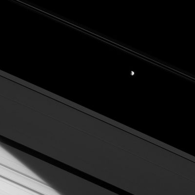 Prometheus
Caption NASA:"The moon Prometheus and a bit of Saturn's Northern Hemisphere are both brilliantly lit by the Sun here, making the A-Ring seem dim in comparison. 
The bright limb of Saturn's Northern Hemisphere can be seen through the A-Ring in the lower left of the image. 
Prometheus (about 86 Km, or approx. 53 miles across) orbits in the Roche Division between Saturn's A and F-Ring. 
For a similar view of Pandora, another of the F-Ring's Shepherding Moons, see PIA09899. 

This view looks toward the sunlit side of the Rings, from about 20° below the Ring-Plane. 
The image was taken in Red Light with the Cassini Spacecraft narrow-angle camera on May 25, 2009. The view was acquired at a distance of approx. 694,000 Km (about 431.000 miles) from Prometheus and at a Sun-Prometheus-Spacecraft, or Phase, Angle of 49°. 
Image scale is roughly 3,6 Km (about 2,2 miles) per pixel".
Parole chiave: Saturn's Moon - Prometheus