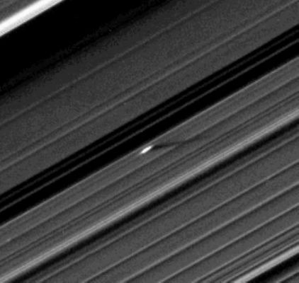 Giant "Propeller" in the A-Ring (EDM)
It has since become a growing realization resulting from Cassini’s exploration of Saturn that the objects forming Saturn’s Rings very likely span the full spectrum of sizes, from the smallest dust-sized ring particles to the ring-moons like Daphnis and 29-Km-wide (18-mile-wide) Pan - a significant advance in divining the origin of Saturn’s Rings. 
The novel illumination geometry that accompanies equinox lowers the Sun’s angle to the Ring-Plane, significantly darkens the Rings and causes out-of-plane structures to cast long shadows across the Rings. (The Rings have been brightened in this image to enhance visibility) 
These scenes are possible only during the few months before and after Saturn’s Equinox which occurs only once in about 15 Earth years. 

This view looks toward the Northern Side of the Rings from about 20° above the Ring-Plane. 
The image was taken in Visible Light with the Cassini Spacecraft narrow-angle camera on Aug. 13, 2009. 

This view was acquired at a distance of approx. 1,2 MKM (about 746.000 miles) from Saturn and at a Sun-Saturn-Spacecraft, or Phase, Angle of 87°. 
Image scale is roughly 7 Km (about 4,5 miles) per pixel.
Parole chiave: Saturn's Rings - "A" Ring