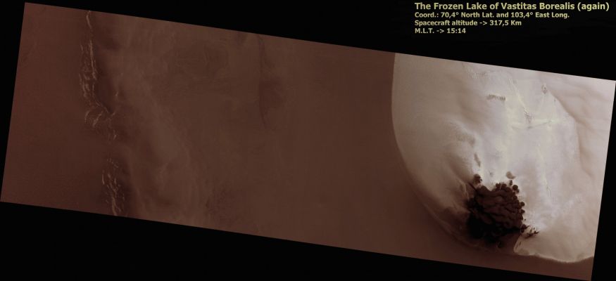 Lauth Crater and the Frozen "Pseudo-Lake" of Vastitas Borealis (CTX Frame - Absolute Natural Colors; credits for the additional process. and color.: Dr Paolo C. Fienga - Lunexit Team)
The right side of PSP_001700_2505 shows a portion of a Frost Patch on a Mound inside a Northern Hemisphere Crater (unofficially known as "Lauth Crater"). 
The Frost Patch has remained largely stable at least since the Viking era (late 1970s). The bright Frost Region is bounded by a Dunefield on the North-East. Several sizes of Dunes are visible. The size classes probably represent generations of Dunes that formed under a variety of dominant wind conditions. 
Parole chiave: Mars from orbit - Craters - Lauth Crater