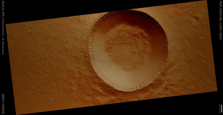 Thila Crater (extremely enhanced natural colors; credits: Lunar Explorer Italia)
Mars Local Time: 15:24 (early afternoon)
Coord. (centered): 18,1° North Lat. and 155,5° East Long.
Spacecraft altitude: 284,2 Km (such as about 177,6 miles) 
Original image scale range: 28,4 cm/pixel (with 1 x 1 binning) so objects ~85 cm across are resolved 
Map projected scale: 25 cm/pixel 
Map projection: EQUIRECTANGULAR 
Emission Angle: 6,0° 
Phase Angle: 42,3°
Solar Incidence Angle: 48° (meaning that the Sun is about 42° above the Local Horizon)
Solar Longitude: 103,1° (Northern Summer)
Credits: NASA/JPL/University of Arizona
Additional process. and coloring: Lunar Explorer Italia
Parole chiave: Mars from orbit - Craters - Thila Crater