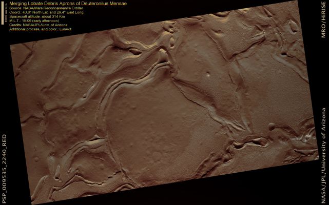 Merging Lobate Debris Aprons of Deuteronilus Mensae (Natural Colors; credits for the additional process. and color.: Dr Paolo C. Fienga - Lunar Explorer Italia)
This image lies within the Deuteronilus Mensae Region, located on the Northern Edge of Arabia Terra and borders the high-standing, heavily cratered Southern Hemisphere and the low, relatively uncratered, plains of the Northern Hemisphere of Mars.

Deuteronilus Mensae is characterized by hills and mesas surrounded by broad debris aprons and this HiRISE image shows examples where lobate-shaped debris aprons appear to overlap.
There is zone of ridges that formed in an area where lobate debris aprons merged from different directions. A current hypothesis is that these ridges are expressions of compressional deformation between two lobes acting like a viscous fluid. One possibility, given the high latitude of the occurrence, is that the lobes of debris are ice-rich and flow somewhat like glaciers.
Recent results from the SHAllow RADar (SHARAD) instrument, also onboard the Mars Reconnaissance Orbiter, indicate that lobate debris aprons in Deuteronilus Mensae are composed of material dominated by ice [Plaut et al., 2008]. 

This supports the interpretation that these might be potential debris-covered glaciers or rock glaciers.

Some of the detailed textures on the surface of the debris aprons are commonly believed to be the result of ice loss due to sublimation (ice changing into water vapor). On Earth, debris-covered glaciers/rock glaciers typically develop wrinkles and fractures due to stresses in the ice as it flows. Where flows merge, they can buckle and push up ridges producing features similar to those visible here.
Parole chiave: Mars from orbit - Deutoronilus Mensae
