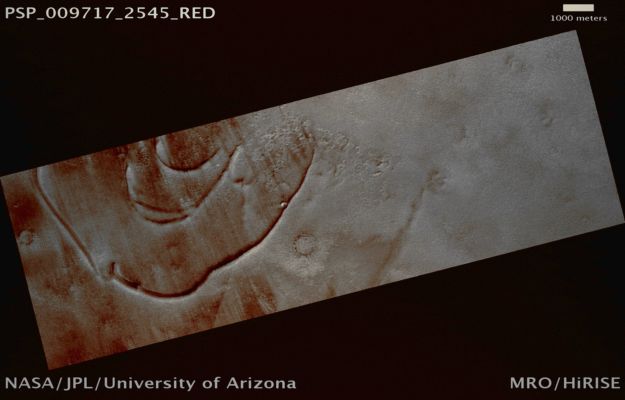 Small Crater on Arcuate Ridge, West of Olympia Mensae (possible True Colors; credits: Lunar Explorer Italia)
Mars Local Time: 14:53 (early afternoon)
Coord. (centered): 74,3° North Lat. and 93,7° East Long.
Spacecraft altitude: 314,9 Km (such as about 196,8 miles) 
Original image scale range: 31,5 cm/pixel (with 1 x 1 binning) so objects ~95 cm across are resolved 
Map projected scale: 25 cm/pixel 
Map projection: EQUIRECTANGULAR 
Emission Angle: 1,9° 
Phase Angle: 55,2°
Solar Incidence Angle: 57° (meaning that the Sun is about 33° above the Local Horizon)
Solar Longitude: 116,3° (Northern Summer)
Credits: NASA/JPL/University of Arizona
Additional process. and coloring: Lunar Explorer Italia
Parole chiave: Mars from orbit - Craters - Unnamed Crater in the North Polar Regions