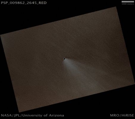 Round and Black Crater on the North Polar Cap (possible True Colors)
Mars Local Time: 13:50 (early afternoon)
Coord. (centered): 84,4° North Lat. and 77,9° East Long.
Spacecraft altitude: 317,9 Km (such as about 198,7 miles) 
Original image scale range: 31,8 cm/pixel (with 1 x 1 binning) so objects ~95 cm across are resolved 
Map projected scale: 25 cm/pixel 
Map projection: EQUIRECTANGULAR 
Emission Angle: 3,2° 
Phase Angle: 61,2°
Solar Incidence Angle: 64° (meaning that the Sun is about 26° above the Local Horizon)
Solar Longitude: 121,6° (Northern Summer)
Credits: NASA/JPL/University of Arizona
Additional process. and coloring: Lunar Explorer Italia

Nota Lunexit: la somiglianza fra questo modesto cratere d'impatto (NASA dixit) ed i "Pit Craters" (o crateri a pozzo, correlati a fenomeni di subsidenza e NON a fenomeni meteorici) è, a dir poco, straordinaria! L'incredibile rotondità del rilievo, inoltre, ci lascia supporre che, se si trattasse effettivamente di un "impact crater", allora il bolide che lo ha creato dovrebbe essere precipitato - letteralmente - "a piombo" sulla superficie di Marte (ossìa con un angolo di impatto pari a circa 90°: un evento più unico che raro!...).
Molto bello e marcato il Windstreak che si diparte dal cratere e che ci lascia supporre l'esistenza di un piccolo margine (rim), non visibile nè percepibile a questa risoluzione.
Parole chiave: Mars from orbit - Craters - Unnamed Crater on the North Polar Cap