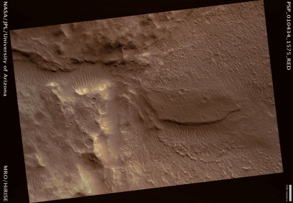 Fan at Valley Mouth (possible True Colors; credits: Lunar Explorer Italia)
This image shows the intersection of a Valley with the floor of a large Impact Crater. The Valley appears to have transported sediment that was deposited on the Crater Floor when the flow slowed. As the Eastern side of the lobate deposit appears to have been sheared off, it is possible that continuing flow from the valley eroded into its own deposits.

The deposit is noticeably different in color from the crater floor, indicating that the Valley transported different sediments. Since the large crater is shallow, likely due to infilling, this suggests that multiple sources of sediment and perhaps multiple deposition processes have affected the geology at this site. 
The deposited material in the lobe at the Valley Mouth displays some interesting textural features. Small boulders are commonly present on its surface. This may demonstrate relatively energetic deposition as in a flash flood, although it is possible that the boulders are superimposed debris from later impact craters.
The Southern End of the deposit is also fracturing into blocks or slabs. These could be relics of old mud cracks, or of thermal contraction cracks formed in Permafrost. 

§§§

Mars Local Time: 15:42 (middle afternoon)
Coord. (centered): 22,4° South Lat. and 336,3° East Long.
Spacecraft altitude: 259,3 Km (such as about 162,1 miles) 
Original image scale range: 25,9 cm/pixel (with 1 x 1 binning) so objects ~78 cm across are resolved 
Map projected scale: 25 cm/pixel
Map projection: EQUIRECTANGULAR 
Emission Angle: 2,6° 
Phase Angle: 68,2°
Solar Incidence Angle: 66° (meaning that the Sun is about 24° above the Local Horizon)
Solar Longitude: 143,2° (Northern Summer)
Credits: NASA/JPL/University of Arizona
Additional process. and coloring: Lunar Explorer Italia
Parole chiave: Mars from orbit - Alluvial Features - Fan