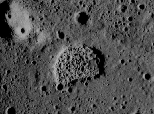APOLLO 17 AS 17-M-R29-1518 - Ina
The so-called "Conventional Wisdom! says the Moon is dead, BUT "Conventional Wisdom" may also - and often - be wrong.
In the journal "Nature" (Nov. 9th, 2006), a team of scientists led by Prof. Peter Schultz of Brown University announced evidence for fresh geologic activity on the Moon. Although lunar volcanism was supposed to have ceased billions of years ago, there's at least one place on the Moon where "outgassing" may have happened within the past 10 million years - and may still be happening today (Schultz, Staid and Pieters, Nature, 444, 184).

The site is a strange-looking geological feature named "Ina" in Lacus Felicitatis, a lake of ancient, hardened lava located at lunar coordinates of about 19° North Lat. and 5° East Long. 
"Ina was first noticed by Apollo Astronauts" says Schultz. Pictured right, "it's shaped like a letter D about two kilometers wide".
Three things about Ina point to recent activity:

1) Ina has mysteriously sharp edges. "Something that razor sharp shouldn't stay around long. It ought to be destroyed within 50 million years" says Schultz. The destroyer of sharp edges on the Moon is a constant rain of small meteoroids that wear down mountains and craters to a nub, given time. Ina's sharp features suggest great youth.

2) Ina is sparsely cratered. While small meteoroids sandblast the terrain into smoothness, larger meteoroids and asteroids make craters. The older the surface, the more heavily cratered it becomes. "Ina is almost devoid of craters" notes Schultz. "We found only two clear impact craters larger than 30 meters on the 8 square kilometers of the structure’s floor". Again, Ina appears young.

3) Ina is bright and has odd colors. Rocks and dirt on the surface of the Moon grow darker as time passes. The darkening agent is space weather: a nonstop rain of cosmic rays, solar radiation and meteoroids hit the Moon and darken the ground. (The mechanisms - a.k.a.: "Space Weathering" - are too detailed to discuss here, but the effect is mostly uncontroversial) 
Ina, however, is bright, as if fresh dirt has been overturned and newly exposed. Furthermore, the colors of Ina, measured by a spectrometer on the Clementine Spacecraft, are similar to the colors of the Moon's youngest craters. Yet Ina is not an impact crater.

It all adds up to outgassing: "We believe there has been a rapid release of gasses, blowing off surface deposits and exposing less weathered materials" explains Schultz. This is not necessarily a sign of active volcanism. "The appearance of the surface at Ina does not indicate an explosive release of magma, which would create visible rays of ejecta surrounding a central crater". 
Instead, the gasses may have been trapped below ground for millions or billions of years and released by, say, a recent moonquake. This interpretation is appealing because Ina is located at the intersection of two linear valleys or rilles - like many geologically active areas on Earth.

"Over the years" he adds, "amateur astronomers have reported puffs or flashes of light coming from the Moon's surface". While many professional astronomers insisted the moon was inactive, the amateur sightings kept open a window of doubt. Schultz thinks it's time to start looking in earnest: "A coordinated observation campaign, including both professional and amateur astronomers, would be one way to build additional evidence for activity. A gas release itself would not be visible for more than a second or so, but the dust it kicked up might stay suspended for 30". With modern alert networks, that's long enough to move a professional telescope into position to see what's happening."

There may be plenty of targets to monitor. The researchers have identified at least four features similar to Ina associated with the same system of rilles, as well as others in neighboring rille systems. 

Could these gases actually prove useful to future lunar explorers? Schultz thinks so. "CO2 and even H2O could be coming out of these vents. But first" he cautions, "we have to find out if the outgassing is real - and what the gases are". This makes Ina an intriguing site for future exploration by robots and people. 

Says Schultz, "the Moon may not be so dead after all".

