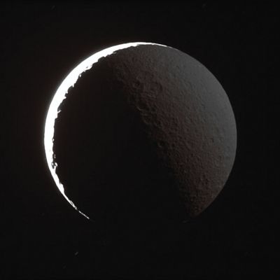 Rhea, in the Saturnshine (natural colors - elab. Lunexit)
Caption NASA:"The night side of Rhea shines softly in reflected light from Saturn. A similar effect, called Earthshine, can often be seen dimly illuminating the dark side Earth's Moon. 
Background stars make short, dim trails across the black sky. The sunlit terrain on Rhea is so much brighter than the part lit by Saturn that the former is completely overexposed in this view, which took more than 30" to acquire. 
This view looks toward the Leading Hemisphere on Rhea. North is up and rotated 28° to the left. 

The image was taken in visible light with the Cassini spacecraft narrow-angle camera on June 11, 2007. The view was obtained at a distance of approx. 364.000 Km (such as about 226.000 miles) from Rhea and at a Sun-Rhea-spacecraft, or phase, angle of 154°. Image scale is roughly 4 Km (about 3 miles) per pixel".
Parole chiave: Saturn's Moons - Rhea