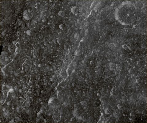 The Heavily Fractured Surface of Rhea (Absolute Natural Colors; credits for the additional process. and color.: Dr Paolo C. Fienga - Lunexit Team)
Caption NASA:"Icy Fractures on Saturn's moon Rhea reflect Sunlight brightly in this High-Resolution Mosaic created from images captured by NASA's Cassini Spacecraft during its March 2, 2010, Fly-By. This Fly-By was the closest one of Rhea up to then.

This mosaic of six images shows the Westernmost portion of the moon's "Wispy" Terrain. Among the interesting features depicted here is a very straight East-West Fracture near the top center of the mosaic that intersects two North-South Fractures. The large Crater at the bottom left of the mosaic is Inmar Crater (about 55 Km, or approx. 34 miles across).
The closest approach of the Spacecraft to Rhea during this encounter was of about 100 Km (approx. 62 miles). These images were obtained approximately 30 minutes later, at an altitude of about 16.000 Km (roughly 10.000 miles).
This mosaic shows part of the side of Rhea that always faces Saturn. The images were re-projected in an orthographic projection centered on Terrain at 7° North Latitude and 296° West Longitude. The mosaic itself shows Features centered on Terrain that is at 6° North Latitude and 293° West Longitude.

The images were taken with the Cassini Spacecraft narrow-angle camera. The view was obtained at a Sun-Rhea-Spacecraft, or Phase, Angle of about 2°. So, Cassini was almost directly between Rhea and the Sun as it acquired these images. 
Image scale is roughly 85 meters (280 feet) per pixel".
Parole chiave: Saturnian Moons - Rhea