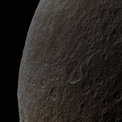 In the Saturnshine (Absolute Natural Colors; credits for the additional process. and color.: Dr Paolo C. Fienga - Lunar Explorer Italia/Italian Planetary Foundation)
Some Southern Terrain on the Gas-Giant Planet Saturn's moon Rhea is dimly illuminated by the Saturnshine (---> the Saturnian equivalent, on Rhea, of the Moonshine, on Earth) in this NASA - Cassini Spacecraft's view of the dark side of the moon. The camera of Cassini is looking toward the night side of Rhea (which is approx. 1530 Km - such as about 950 miles - across), but the Sunlight reflected off the day side of the immense Saturn is bright enough to illuminate the Surface - with all its Impact Craters - seen here. This view is centered on Terrain located at 23° South Latitude and 315° West Longitude. If you look carefully beyond the Limb of Rhea, you will notice that 4 (four) background Stars are visible. 

The image was taken in Visible Light with the NASA - Cassini Spacecraft Wide-Angle Camera on August, 1st, 2011. The view was obtained at a distance of approximately 6000 Km (such as about 3726 miles) from Rhea and at a Sun-Rhea-Cassini Spacecraft, or Phase, Angle of 113°. Scale in the original image was 800 meters (such as 2600 feet) per pixel.

This frame (which is an Original NASA - Cassini Spacecraft image published on the NASA - Planetary Photojournal with the ID n. PIA 14574) has been additionally processed, contrast enhanced, and then colorized in Absolute Natural Colors (such as the colors that a human eye would actually perceive if someone were onboard the NASA - Cassini Spacecraft and then looked outside, towards the Saturnian moon Rhea), by using an original technique created - and, in time, dramatically improved - by the Lunar Explorer Italia Team. Different colors, as well as different shades of the same color, mean, among others, the existence of different Elements present on the Surface of Rhea, each having a different Albedo (---> Reflectivity) and Chemical Composition.
Parole chiave: Saturnian Moons - Rhea
