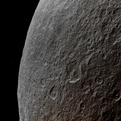 Rhea in the Saturnshine (Enhanced Absolute Natural Colors; credits for the additional process. and color: Dr Paolo C. Fienga - Lunexit Team)
Caption NASA:"Southern Terrain on Saturn's moon Rhea is dimly illuminated by Saturnshine in this Cassini Spacecraft view of the dark side of the moon. The Spacecraft's camera is looking toward the night side of Rhea, but sunlight reflected off the day side of immense Saturn is bright enough to illuminate the Craters seen here. This view is centered on Terrain located at about 23° South Latitude and 315° West Longitude. A few background stars are visible.

The image was taken in Visible Light with the Cassini Spacecraft wide-angle camera on Aug. 1, 2011. The view was obtained at a distance of approx. 6000 Km (such as about 3700 miles) from Rhea and at a Sun-Rhea-Spacecraft, or Phase, Angle of 113°. Scale in the original image was 800 meters (2600 feet) per pixel. The image was contrast enhanced and magnified by a factor of 1.5 to enhance the visibility of the surface features".
Parole chiave: Saturnian Moons - Rhea