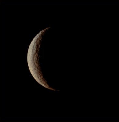 Crescent Rhea (Absolute Natural Colors; credits for the additional process. and color.: Dr Paolo C. Fienga/Lunar Explorer Italia/Italian Planetary Foundation)
The NASA - Cassini Spacecraft captured, about four months ago, Saturn's moon Rhea during its Crescent Phase: a view, this one, which will never be visible from Earth. Near the Terminator, a few of Rhea's many Impact Craters show up their sharp and well defined outlines. With a diameter of approx. 950 miles (such as almost 1529 Km) Rhea is the Saturnian second-largest moon. This view looks toward the Leading Hemisphere of Rhea; North is up and rotated 12° to the right. 

The image was taken in Visible Light with the NASA - Cassini Spacecraft Narrow-Angle Camera on November 6, 2012. The view was obtained at a distance of approximately 1,2 Million Miles (such as about 1,93 Million KiloMeters) from Rhea and at a Sun-Rhea-Cassini Spacecraft, or Phase, Angle of 129°. Scale in the original image was roughly 7 miles (approx. 11,26 Km) per pixel but, afterwards, the picture was magnified by a factor of 1.5 in order to enhance the visibility of some Surface Features.

This picture (which is an Original NASA - Cassini Spacecraft b/w frame published on the NASA - Planetary Photojournal with the ID n. PIA 14647) has been additionally processed, magnified (by applying a further 4.01 enlargement's factor) and then colorized, according to an educated guess carried out by Dr Paolo C. Fienga (LXTT-IPF), in Absolute Natural Colors (such as the colors that a human eye would actually perceive if someone were onboard the NASA - Cassini Spacecraft and then looked outside, towards the Saturnian moon Rhea), by using an original technique created - and, in time, dramatically improved - by the Lunar Explorer Italia Team. Different colors, as well as different shades of the same color, mean, among others, the existence of different Elements present on the Surface of Rhea, each having a different Albedo (---> Reflectivity) and Chemical Composition.
Parole chiave: Saturnian Moons - Rhea