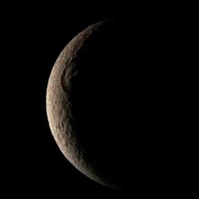 Tirawa Basin on Reha, from Voyager 1 (Natural Colors; credits: Ted Stryk)
As Voyager 1 receded from its close flyby of Rhea, it snapped this view of Rhea's Tirawa Basin, a large impact structure seen on the Terminator in this crescent view. 
It is on of the worst-imaged parts of this world, and this Voyager view is still the best. Rhea is a moon that shows some similar features to more active Dione and Tethys, but seems to have been inactive for longer, as evidenced by the fact that all of its surface is extremely worn from impacts and the evidences of internal activity are much more subtle.
Parole chiave: Saturn's Moons - Rhea