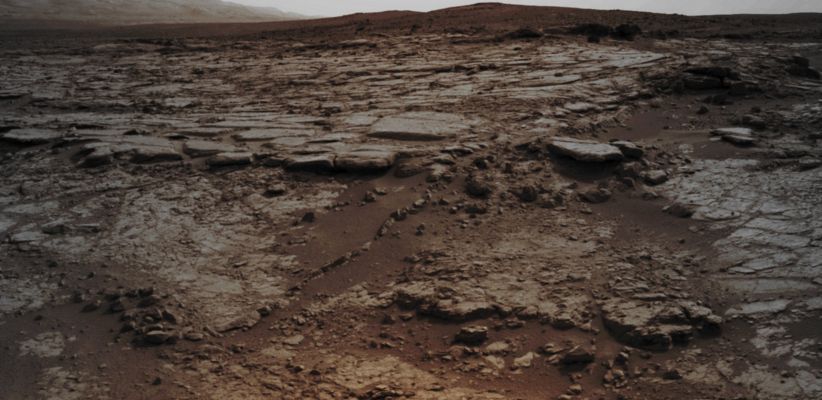 Snake River - Sol 133 (Absolute Natural Colors; credits for the additional process. and color.: Dr Paolo C. Fienga/Lunar Explorer Italia/Italian Planetary Foundation)
The sinuous Rock Feature visible in the lower center and left (Sx) side of this mosaic of frames recorded by the NASA - Mars Exploration Rover (MER) - Mars Laboratory "Curiosity" has been nicknamed "Snake River" (and we honestly believe that, once you notice the actual physical configuration of the Rocky Feature that is now under a - relatively - close observation, the reason of the nickname will result more than obvious...). 

The images forming the mosaic were taken by Curiosity's Navigation Camera (NavCam) during the 133rd Martian Day, or Sol, of the Rover's Mission in Gale Crater - Mars (such as December, 20th, 2012). On Sol 147 (such as January, 3rd, 2013), the NASA - Mars Exploration Rover (MER) - Mars Laboratory "Curiosity" drove about 10 feet (approx. 3 meters) to get a closer look at "Snake River", before proceeding to watch, photograph and then examine other Rocky Features located in the same area as well as in other areas nearby.

This picture (which is an Original NASA - Mars Exploration Rover - Mars Laboratory "Curiosity" b/w image-mosaic published on the NASA - Planetary Photojournal with the ID n. PIA 16564) has been additionally processed and then colorized in Absolute Natural Colors (such as the colors that a human eye would actually perceive if someone were near the NASA - Mars Exploration Rover (MER) - Mars Laboratory "Curiosity" and then looked ahead, towards the Rocky Surface Feature called "Snake River", the Rocky Paving located in front of and around the Rover, as well as the more distant Horizon of Gale Crater), by using an original technique created - and, in time, dramatically improved - by the Lunar Explorer Italia Team. Different colors, as well as different shades of the same color, mean, among other things, the existence of different Elements (Minerals) present on the Surface of Gale Crater, each having a different Albedo (---> Reflectivity) and Chemical Composition.
Parole chiave: Martian Surface - "Snake River"