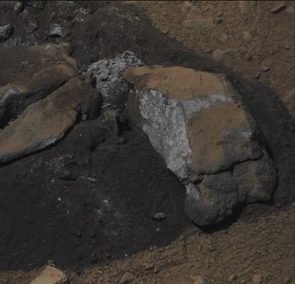 Sutton Inlier - Sol 174 (Absolute Natural Colors; credits for the additional process. and color.: Dr Paolo C. Fienga/Lunar Explorer Italia/Italian Planetary Foundation)
This frame, which was taken by the Mast Camera (MastCam) onboard the NASA - Mars Exploration Rover (MER) - Mars Laboratory "Curiosity", shows us some very interesting colors which were found inside a Rock called "Sutton Inlier": a relatively small Rock that was broken by the Rover itself, while driving over it. 

The MastCam took this image during the 174th Martian Day, or Sol, of the Rover's work at Gale Crater - Mars (such as January 31, 2013 on Earth). The Rock is about 5" - inches - (such as 12,7 centimeters) wide at the end closest to the camera. The inside of the Rock, which is found in the "Yellowknife Bay" area of Gale Crater, shows us a color that lies in between from a light gray to a very pale blue, and without traces of orange or red (the colors that, as you know, are the typical ones that characterize almost all the exposed - to the Martian Open Environment - Dusty and/or Rocky Materials and Surfaces).

This picture (which is an Original NASA - Mars Exploration Rover - Mars Laboratory "Curiosity" natural"color frame published on the NASA - Planetary Photojournal with the ID n. PIA 16804) has been additionally processed and then re-colorized in Absolute Natural Colors (such as the colors that a human eye would actually perceive if someone were near the NASA - Mars Exploration Rover (MER) - Mars Laboratory "Curiosity" and then looked ahead, towards the Rock dubbed "Sutton Inlier", which is located in front of the Rover), by using an original technique created - and, in time, dramatically improved - by the Lunar Explorer Italia Team. Different colors, as well as different shades of the same color, mean, among other things, the existence of different Elements (Minerals) present on the Surface of Gale Crater, each having a different Albedo (---> Reflectivity) and Chemical Composition.
Parole chiave: Martian SUrface - Rock - Gale Crater - Sutton Inlier