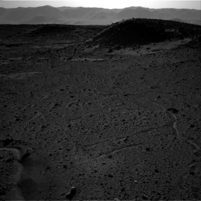 Bright Spark in the distance (Original NASA - Mer Curiosity Frame) - Sol 589
This image from the Navigation Camera (Navcam) on NASA's Curiosity Mars rover includes a bright spot near the upper left corner. The sun is in the same direction, west-northwest, above the frame. Bright spots appear in images from the rover nearly every week. Typical explanations for them are cosmic rays hitting the light detector or sunlight glinting from rocks.

The right-eye camera of the stereo Navcam recorded this frame during the afternoon of the 589th Martian day, or sol, of Curiosity's work on Mars (April 3, 2014), from the site where the rover reached a waypoint called "the Kimberley" by that sol's drive. An image taken by the Navcam's left-eye camera within one second of the same time (http://mars.jpl.nasa.gov/msl/multimedia/raw/?rawid=NLB_449790582EDR_F0310000NCAM00262M_&s=589) does not include a bright spot of this type. A pair of Navcam images in the same direction from the previous afternoon has a bright spot similarly located in the right-eye image http://mars.jpl.nasa.gov/msl/multimedia/raw/?rawid=NRB_449700848EDR_F0301254NCAM00252M_&s=588) but not in the left-eye image (http://mars.jpl.nasa.gov/msl/multimedia/raw/?rawid=NLB_449700848EDR_F0301254NCAM00252M_&s=588).

One possible explanation for the bright spot in this image is a glint from a rock surface reflecting the sun. Another is a cosmic ray hitting the camera's light detector, a CCD (charge-coupled device). Cosmic ray patterns in Mars rover images vary from a dot to a long line depending on the angle at which the ray strikes the detector.

NASA's Jet Propulsion Laboratory, a division of the California Institute of Technology, Pasadena, manages the Mars Science Laboratory Project for NASA's Science Mission Directorate, Washington. JPL designed and built the project's Curiosity rover and the Rover's Navcam.
Parole chiave: Martian Surface - possible Anomaly