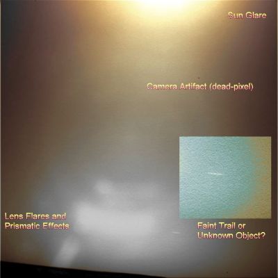 A cloud or something else? (context frame in natural colors and inset in natural but highly enhanced colors; credits: Lunexit)
Un modestissimo fotomosaico in colori naturali (tranne l'inset, il quale è stato sottoposto ad over-stretching) che ci mostra il curioso "oggetto" che staziona nel Cielo di Marte.

Si, una volta processato il frame al massimo delle nostre possibilità, il dettaglio che attrasse la nostra attenzione qualche anno fa non sembra più essere tanto una "scia", quanto un vero e proprio oggetto (probabilmente di grandi dimensioni, ma questa è una considerazione assolutamente intuitiva) che stazionava - o che si muoveva molto lentamente - nel Cielo di Marte, ai limiti della capacità visiva della camera del Rover.

Una sola "certezza" - si fa per dire... -: il dettaglio NON E', NON RAPPRESENTA un image-artifact. 
Parole chiave: Martian Sky - Controversial Frame