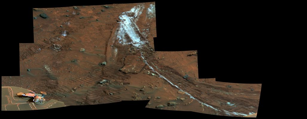 Rover�s Wheel churns-up bright Martian Soil - Sol 1202 (False Colors; credits: NASA/JPL-Caltech/Cornell)
Caption NASA:"NASA’s Mars Exploration Rover Spirit acquired this mosaic on the mission’s 1202nd Martian Day, or Sol (such as May 21, 2007), while investigating the area East of the elevated plateau known as “Home Plate” in the “Columbia Hills”.
The mosaic shows an area of disturbed soil, nicknamed “Gertrude Weise” by scientists, made by Spirit's stuck right Front Wheel. 

The trench exposed a patch of nearly pure silica, with the composition of opal. It could have come from either a hot-spring environment or an environment called a fumarole, in which acidic, volcanic steam rises through cracks. Either way, its formation involved water, and on Earth, both of these types of settings teem with microbial life. 
The image is presented here in false color that is used to bring out subtle differences in color".
Parole chiave: Martian Surface - Rover Tracks and colourful Rocks