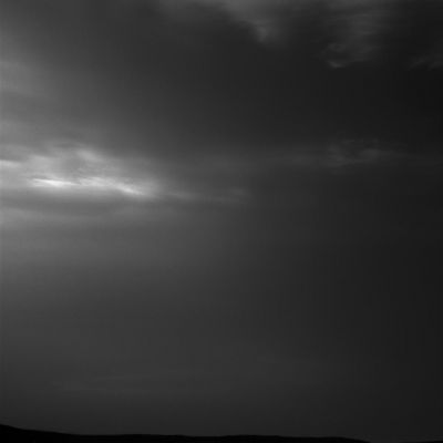 Noctilucent Clouds over Gale Crater - Sol 2405
Caption NASA Originale:"NASA's Curiosity Mars rover imaged these drifting Clouds on May 12, 2019, the 2405th Martian Day, or Sol, of the mission, using its black-and-white Navigation Cameras (NavCams).

These are likely water-ice clouds about 19 miles (such as approx. 30,557 Km) above the Surface. They are also "Noctilucent" Clouds, meaning they are so high that they are still illuminated by the Sun, even when it's night at Mars' Surface. Scientists can watch when light leaves the clouds and use this information to infer their altitude".
Parole chiave: Martian Sky - Clouds
