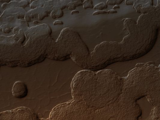 South Polar Layered Deposits and Residual Cap (Absolute Natural Colors; credits for the additional process. and color.: Dr Paolo C. Fienga - Lunexit Team)
This image from NASA's Mars Reconnaissance Orbiter (MRO) shows a variety of surface textures within the South Polar Residual Cap of Mars.

It was taken during the Southern Spring, when the Surface was covered by seasonal CO2 Frost, so that Surface relief is easily seen. Illumination is from the bottom left, highlighting long Troughs at to the right and round pits and irregular Mesas to the left of center.

These unique landforms are common in the South Polar Residual Cap, which is known from previous Mars Global Surveyor images to be eroding rapidly in places. Right of center, SPLDs are exposed on a Sun-facing Scarp. These Deposits are older than the Residual Ice Cap, and the Layers are thought to record climate variations on Mars similar to ice ages on Earth. 
Parole chiave: Mars from orbit - South Polar Layered Deposits and Residual Cap