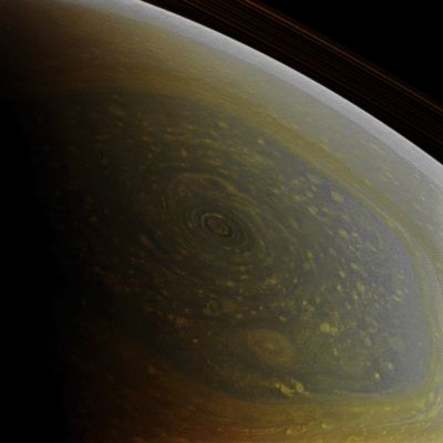 North Polar Spring (Absolute Natural Colors; credits for the additional process. and color.: Dr Paolo C. Fienga/Lunar Explorer Italia/Italian Planetary Foundation)
The North Pole of the Gas-Giant Planet Saturn, now illuminated by the fresh lights of the incoming Spring, is finally revealed in this image taken by the NASA - Cassini Spacecraft on November 27, 2012. As you know, the North Pole of Saturn has been hiding for a long time from the gaze of the Cassini's Imaging Cameras, and that circumstance was due to the fact that it was still Wintertime in (and therefore a deep darkness all over) the Northern Hemisphere of the Ringed Planet when the Spacecraft arrived in the Saturnian System in the AD 2004.

A Hurricane-like Storm circling Saturn's North Pole at about 89° North Latitude is also well visible inside the famous "Hexagon" Feature, which scientists think is a wandering Jet-Stream that whips around the North Pole of Saturn at a relatively constant mean speed of about 220 miles per hour (such as a little more than 354 Km per hour). Such a Jet-Stream it is folded into a six-sided shape because the Hexagon is a Stationary Wave that guides the path of the Gases existing inside the Jet itself. The Hexagon borders occur at about 77° North Latitude and the Feature is wider than two (flat) Earths. Last, but not least, a little section of the Rings of Saturn can also be seen in the upper right corner of the image.

This frame was acquired with the NASA - Cassini Spacecraft Wide-Angle Camera at a distance of approximately 260.000 miles (such as a little more than 418.000 Km) from the top of the Saturnian Clouds and at a Sun-Saturn-Cassini Spacecraft, or Phase, Angle of 96°. Image scale is roughly 18 miles (such as 28,968 Km) per pixel. For another image of the Hexagon and the Hurricane-like Storm that encircles the North Pole of Saturn, please refer to the APOD of December, 29, 2012.

This frame (which is a NASA - CASSINI Spacecraft Original Natural Color frame published on the NASA - Planetary Photojournal and identified by the serial n. PIA 14945) has been additionally processed, magnified, contrast enhanced and then re-colorized, according to an educated guess carried out by Dr Paolo C. Fienga (LXTT-IPF), in Absolute Natural Colors (such as the colors that a human eye would actually perceive if someone were onboard the NASA - Cassini Spacecraft and then looked outside, towards the North Pole of Satun), by using an original technique created - and, in time, dramatically improved - by the Lunar Explorer Italia Team. Different colors, as well as different shades of the same color, mean, among others, the existence of different Elements in the Upper Atmosphere of Satun, each having a different Albedo (---> Reflectivity) and Chemical Composition.
Parole chiave: Saturn - Upper Atmosphere - North Polar Vortex