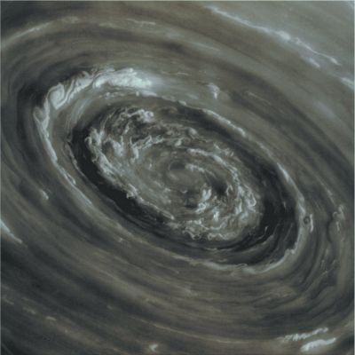 Peering into the Storm (Absolute Natural Colors - Credits for the additional process. and color.: Dr Paolo C. Fienga/Lunar Explorer Italia/Italian Planetary Foundation)
The NASA - Cassini Spacecraft has been traveling the Saturnian System in a set of inclined, or "tilted", orbits that are giving to the mission scientists a vertigo-inducing view of Saturn's Polar Regions. This perspective has yielded images of roiling Storm Clouds and a swirling Vortex at the center of Saturn's famed North Polar Hexagon. This phenomenon mimic what Cassini found at Saturn's South Pole a few years ago. The Spacecraft has also seen several Storms circling Saturn's North Pole in the past, but only in InfraRed Wavelengths, since the North Pole was in complete darkness. But now, with the change of the Saturnian Season, the Sun has finally begun to creep over the Gas-Giant Planet's North Pole, which has therefore become visible even in the Wavelenghts of Visible Light. This particular image was taken on November, 27, 2012, with Cassini's Narrow-Angle Camera. The Camera, at the time the picture was obtained, was pointing toward Saturn from approximately 224.618 miles (such as about 361.488 kilometers) away. 

This picture (which is an Original NASA - Cassini Spacecraft b/w frame identified by the n. IMG004677-br500) has been additionally processed and then colorized, according to an informed speculation carried out by Dr Paolo C. Fienga (LXTT-IPF), in Absolute Natural Colors (such as the colors that a human eye would actually perceive if someone were onboard the NASA - Cassini Spacecraft and then looked outside, towards the North Pole of Saturn), by using an original technique created - and, in time, dramatically improved - by the Lunar Explorer Italia Team. Different colors, as well as different shades of the same color, mean, among others, the existence of different Elements present in the Atmosphere of Saturn, each having a different Albedo (---> Reflectivity) and Chemical Composition. 
Parole chiave: Saturn - Upper Atmosphere - North Polar Vortex