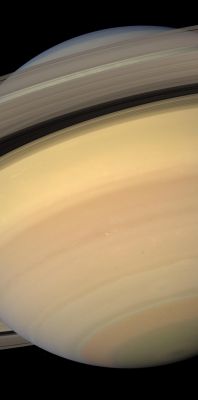 The Southern Regions of Saturn
Caption NASA:"With pastel blues, pinks, greens and golds, Saturn displays a dazzling diversity of colors and hues. 
Here, Cassini looks upward at, and through, the sunlit side of the Rings from about 19° below the Ring-Plane. The small moon Janus can be spotted off the Planet's Western Limb (edge) near the image bottom. 

Images taken using red, green and blue spectral filters were combined to create this natural-color view. The images were obtained with the Cassini spacecraft wide-angle camera on Feb. 3, 2007, at a distance of approx. 1,1 MKM (about 700.000 miles) from Saturn. 
Image scale is roughly 60 Km (about 38 miles) per pixel".
Parole chiave: Saturn