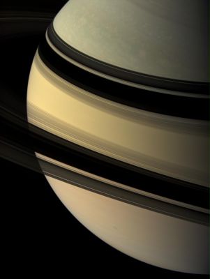 Mirrors of Darkness...
Our robotic explorer Cassini regards the shadow-draped face of Saturn. 
This view looks toward the unilluminated side of the Rings from about 14° above the Ring-Plane. In this viewing geometry all of the Main Rings, except for the B-Ring, appear transparent. The Rings cast their mirror image onto the Planet beyond. 

Images taken using red, green and blue spectral filters were combined to create this natural color view. The images were acquired with the Cassini spacecraft wide-angle camera on June 9, 2007, at a distance of approx. 1,6 MKM (about 972.000 miles) from Saturn. 
Image scale is roughly 90 Km (about 56 miles) per pixel. 
Parole chiave: Saturn